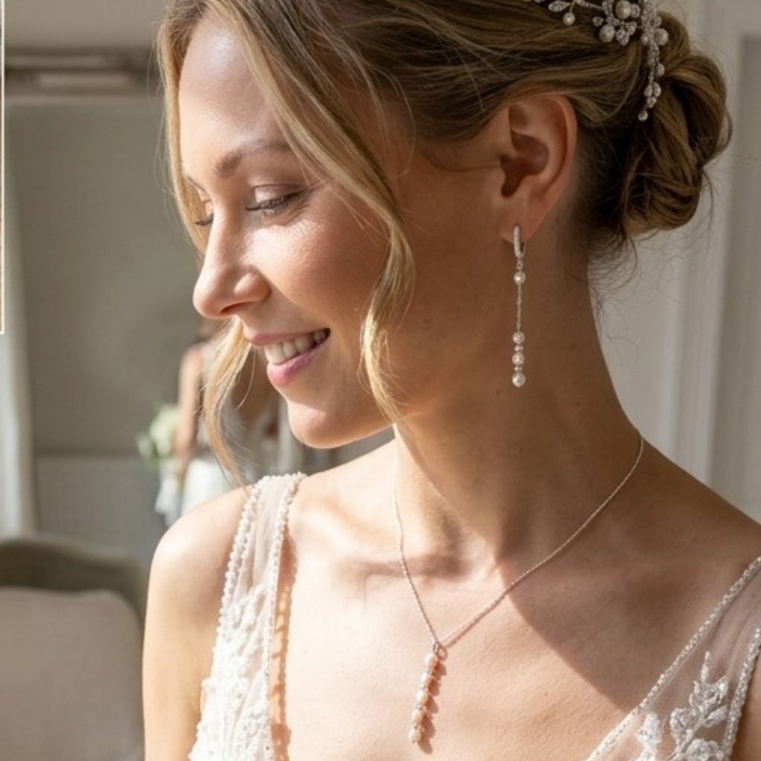 Bride wearing freshwater pearl and crystal drop earrings. The sterling silver leverback earring have just a hint of sparkle in the small crystals. A perfect match to our pearl backdrop wedding necklaces