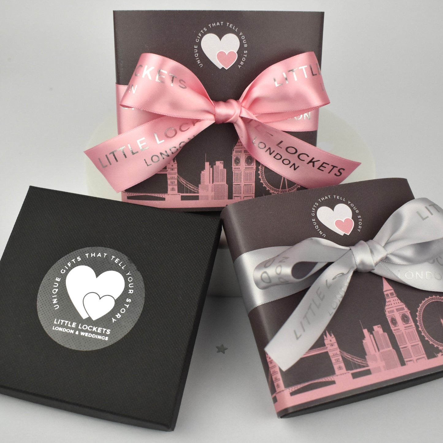 Little Lockets London optional gift wrap. Choose from a branded gift box, or with added London skyline wrap and branded handtied ribbon in grey or pink.