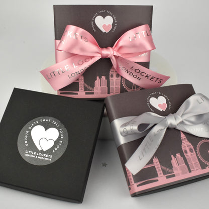 Little Lockets London optional gift wrap. Choose from a branded gift box, or with added London skyline wrap and branded handtied ribbon in grey or pink.
