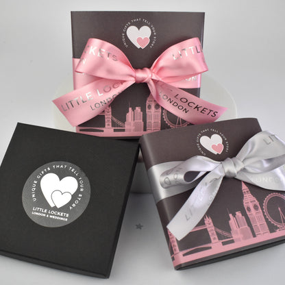 Your item will be mounted on card and presented in a branded gift box. Upgrade your gift wrap by adding a London skyline wrap secured with grey or pink hand tied ribbon.
