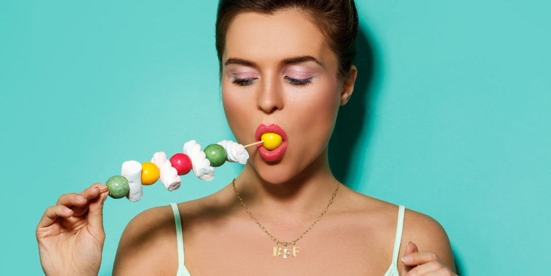 Model wears Necklace chain with and letters. Crafted with a 5.5mm link size chain in gold vermeil with serif letters spelling out  BFF (Best Friends Forever). Each letter is a classic serif uppercase font.