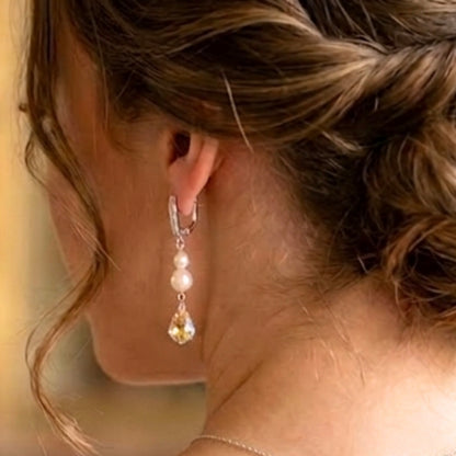 Pair of dazzling freshwater pearl and crystal earrings, with a baroque style crystal drop. The earrings are leverback with just a row of tiny crystals along the front. 