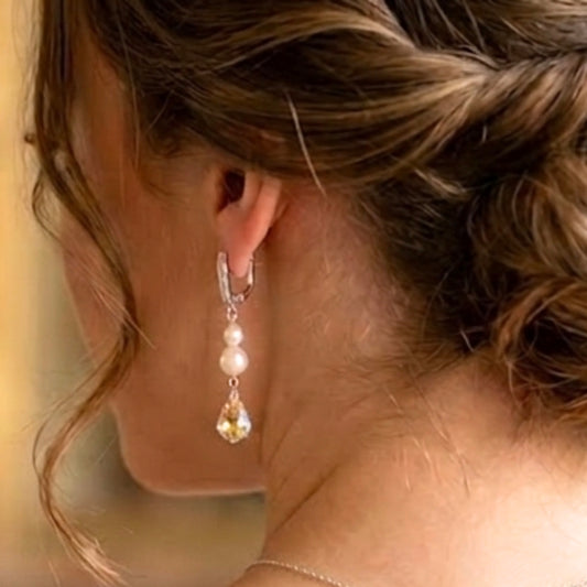 Pair of dazzling freshwater pearl and crystal earrings, with a baroque style crystal drop. The earrings are leverback with just a row of tiny crystals along the front. 