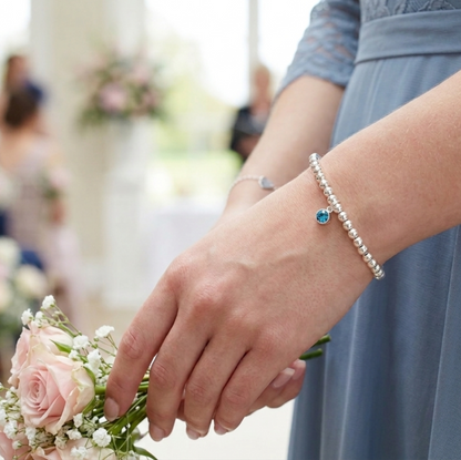 Our polished 4mm beaded bracelet shown with a September (sapphire) crystal birthstone. Elasticated in two sizes for easy fit.
