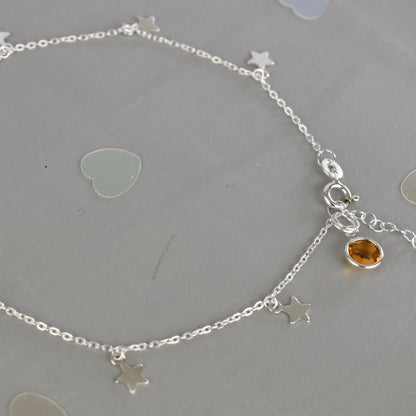 Boho Star Sterling Silver Anklet with Crystal Birthstone Charm. Crafted from sterling silver with flat cable chain links to sit comfortably. A secure fit, thanks to its 9 inch chain and a 1 inch extender.
