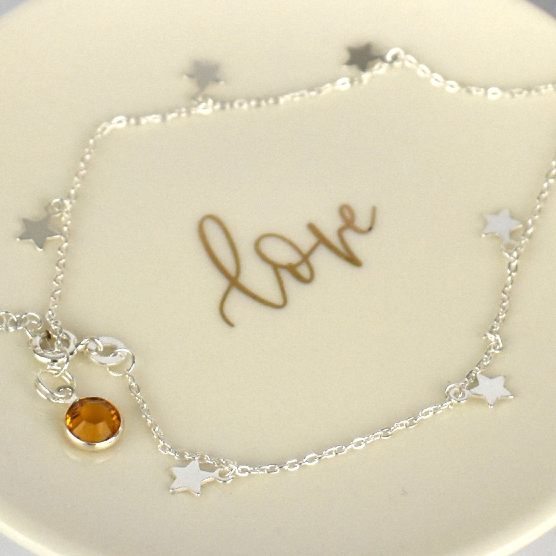 Boho Star Sterling Silver Anklet with Crystal Birthstone Charm. Crafted from sterling silver with flat cable chain links to sit comfortably. A secure fit, thanks to its 9 inch chain and a 1 inch extender.