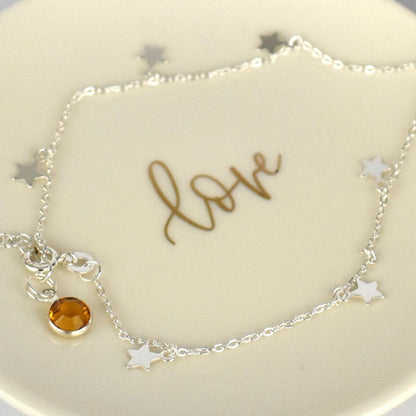 Boho Star Sterling Silver Anklet with Crystal Birthstone Charm. Crafted from sterling silver with flat cable chain links to sit comfortably. A secure fit, thanks to its 9 inch chain and a 1 inch extender.