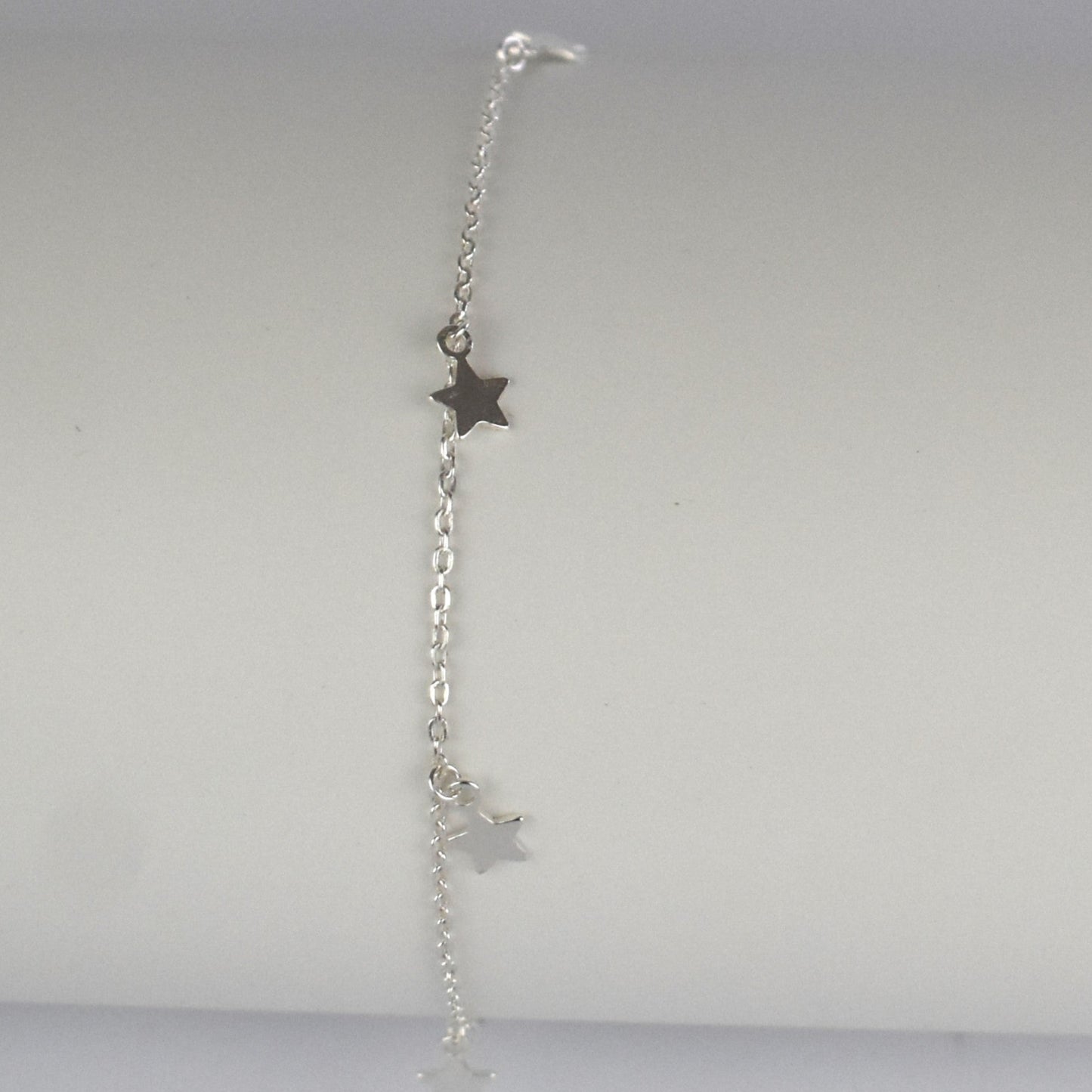 Boho Star Sterling Silver Anklet with Crystal Birthstone Charm. Crafted from sterling silver with flat cable chain links to sit comfortably. A secure fit, thanks to its 9 inch chain and a 1 inch extender.