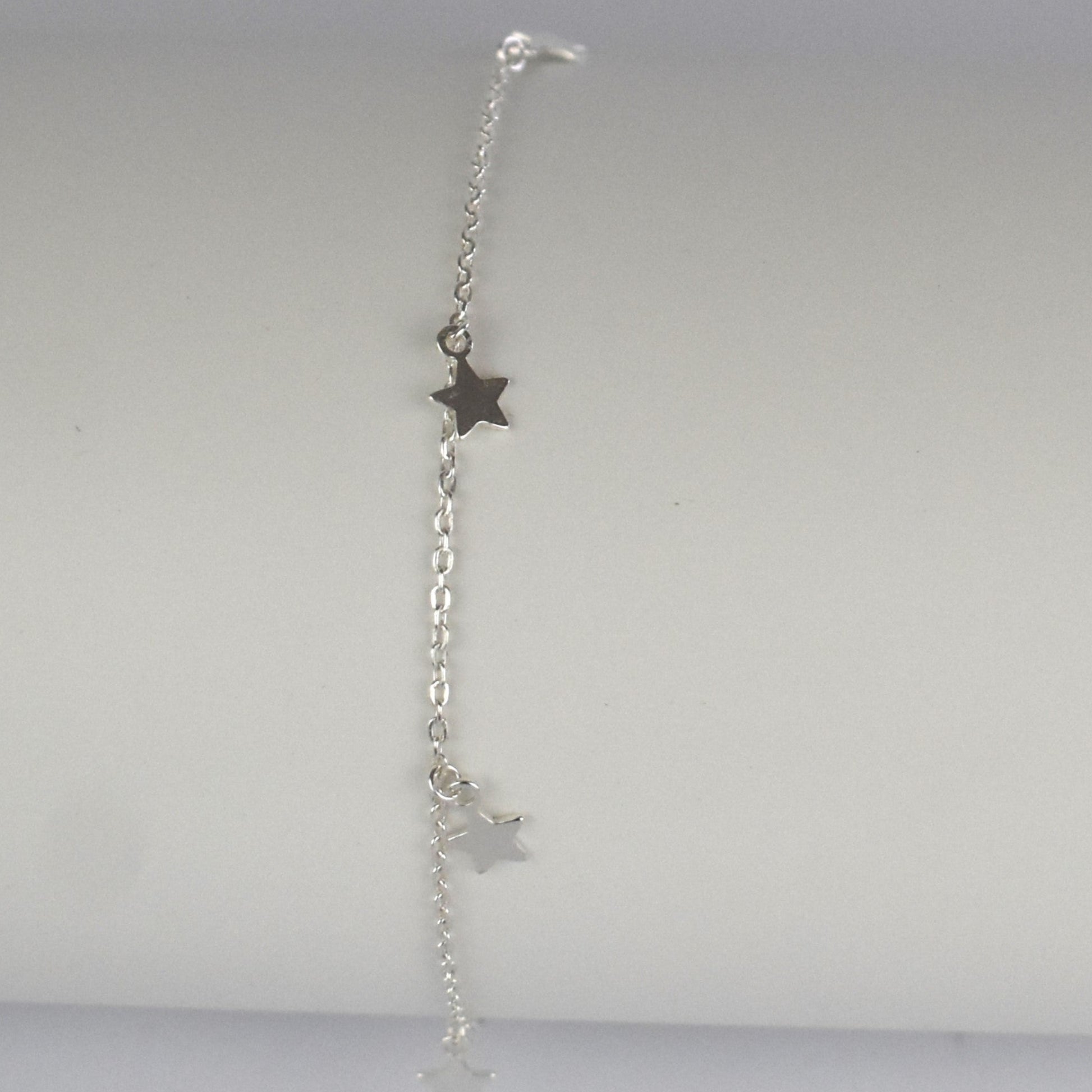 Boho Star Sterling Silver Anklet with Crystal Birthstone Charm. Crafted from sterling silver with flat cable chain links to sit comfortably. A secure fit, thanks to its 9 inch chain and a 1 inch extender.
