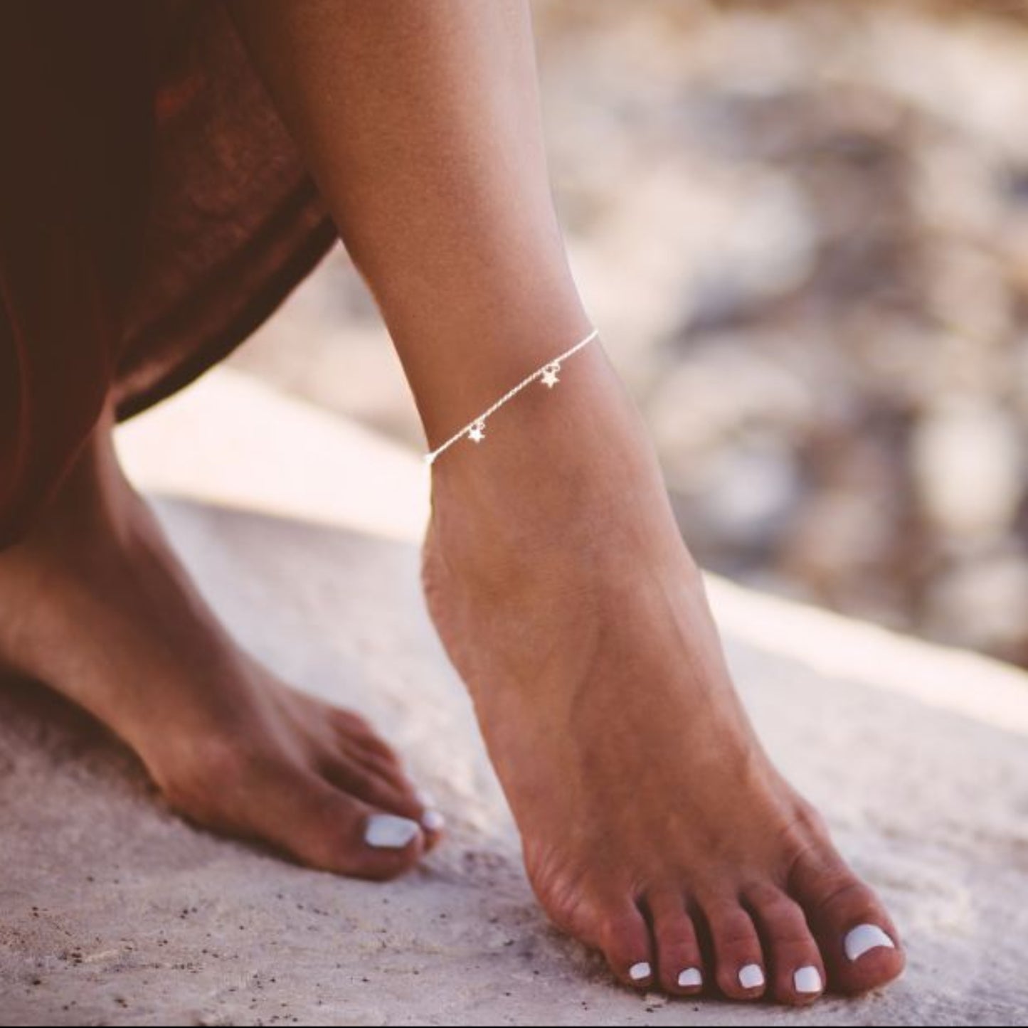 Boho Star Sterling Silver Anklet with Crystal Birthstone Charm. Crafted from sterling silver with flat cable chain links to sit comfortably. A secure fit, thanks to its 9 inch chain and a 1 inch extender.