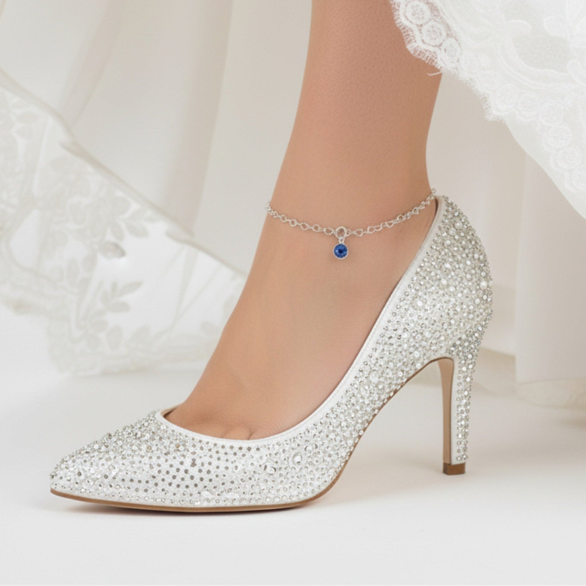 Bride wears Sterling Silver heart link anklet with something blue sapphire crystal charm