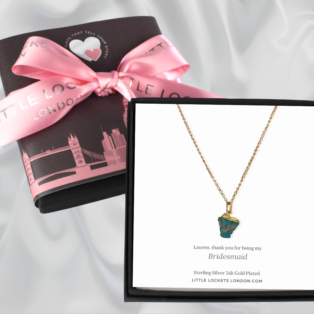 Natural crystal pendant shown in gift box with personalised gift card