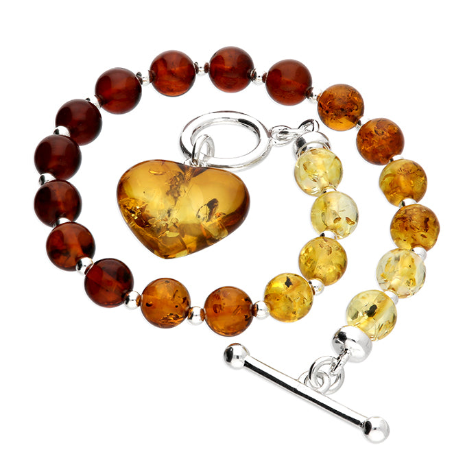 Cognac amber bracelet fastened with sterling silver TBar clasp showing graduation of beads