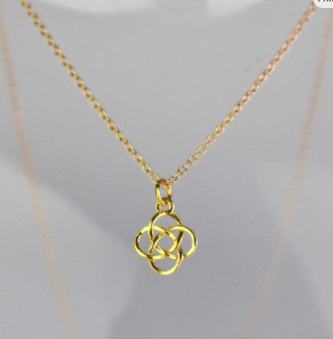 Celtic Knot Pendant Necklace shown in gold plated. A Celtic Knot charm hanging from a cable chain.
