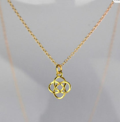Celtic Knot Pendant Necklace shown in gold plated. A Celtic Knot charm hanging from a cable chain.