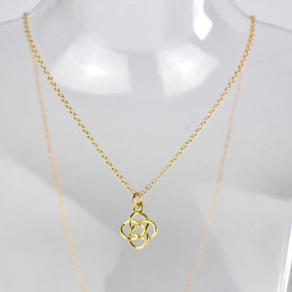 Celtic Knot Pendant Necklace shown in gold plated. A Celtic Knot charm hanging from a cable chain.