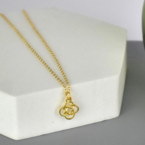 Celtic Knot Pendant Necklace shown in gold plated. A Celtic Knot charm hanging from a cable chain.