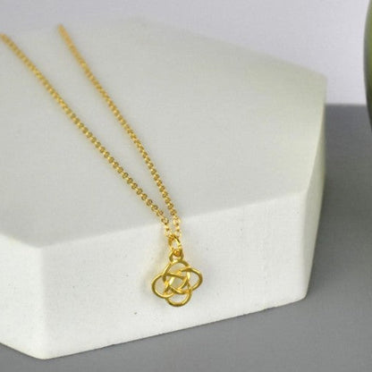 Celtic Knot Pendant Necklace shown in gold plated. A Celtic Knot charm hanging from a cable chain.