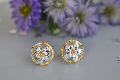 Forget me not earrings made from sterling silver with gold plated accents. Stud earrings.