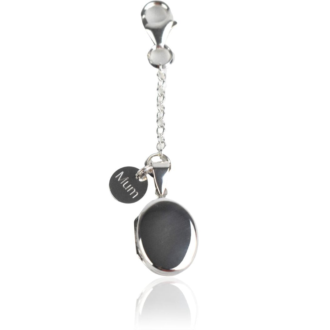 Sterling silver oval photo pocket locket shown with Spring clasp fastening and engraved round tag