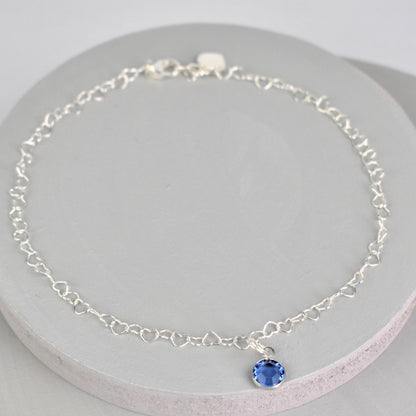 Sterling silver heart link anklet with something blue crystal charm