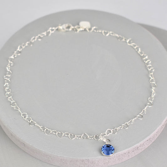 Sterling silver heart link anklet with something blue crystal charm