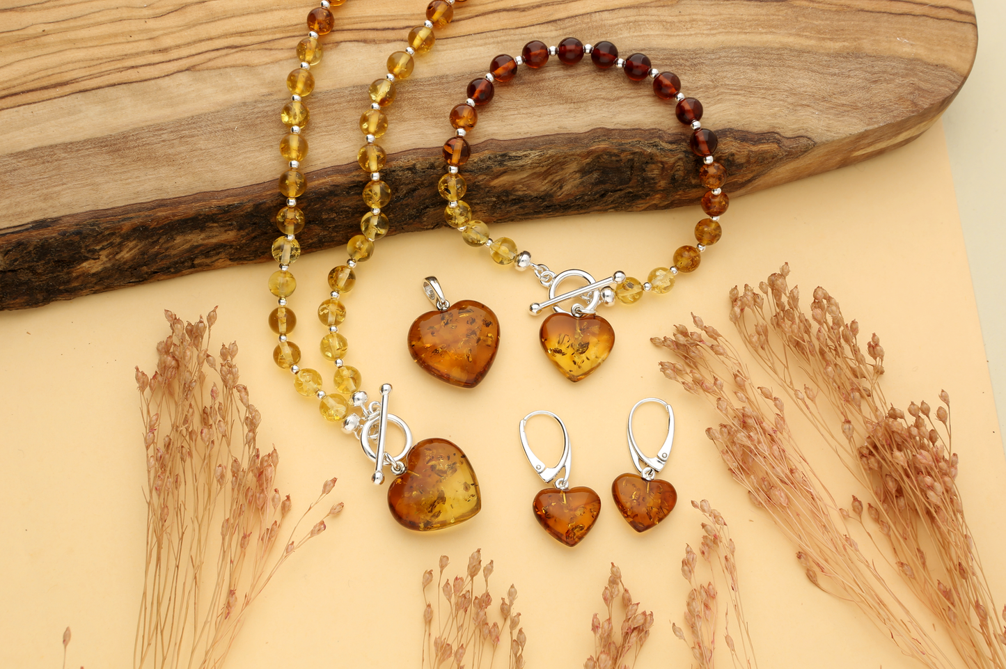 A complete range of amber heart jewellery, using cognac amber, a transparent amber showing all the elements that characterise it.