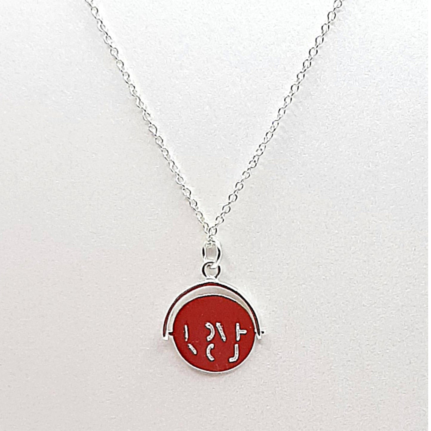Sterling silver disc which when spun forms the words "I LOVE YOU"