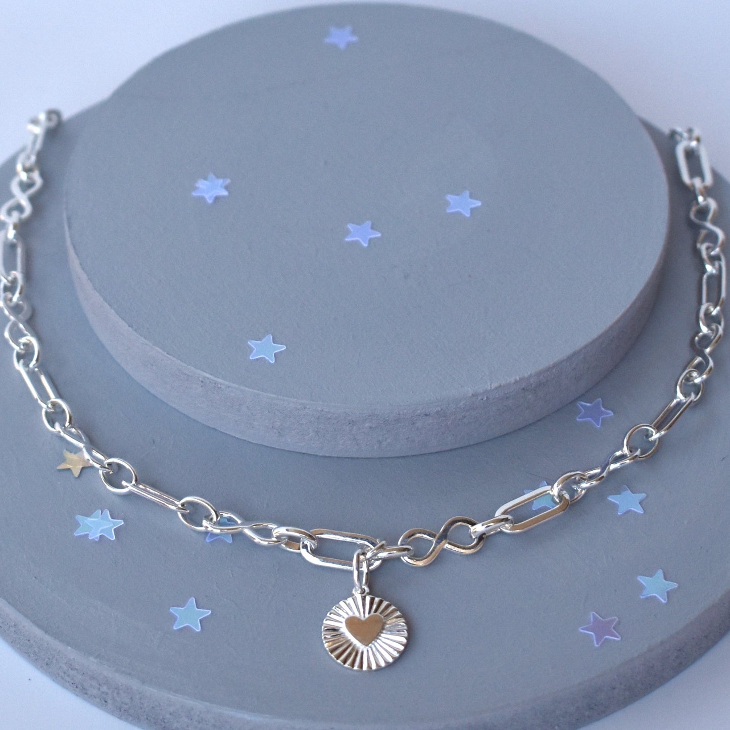 Sterling silver infinity link necklace with sunburst pendant
