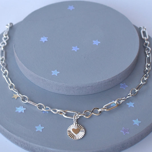 Sterling silver infinity link necklace with sunburst pendant