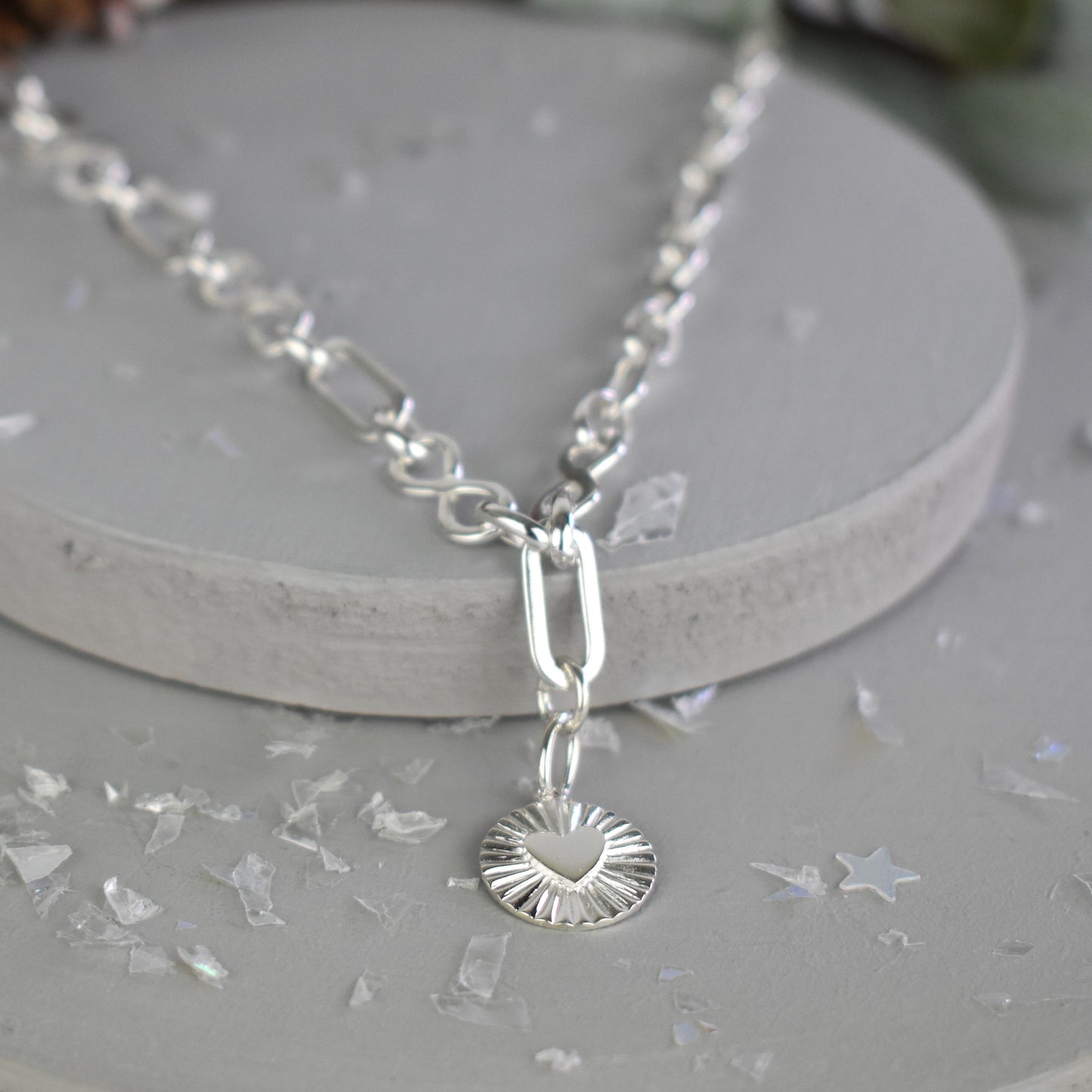 Sterling silver infinity link necklace with sunburst pendant