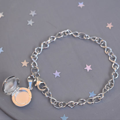 Sterling silver miniature locket on infinity link bracelet