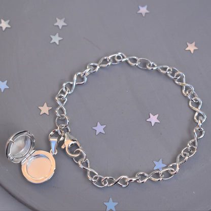 Sterling silver miniature locket on infinity link bracelet