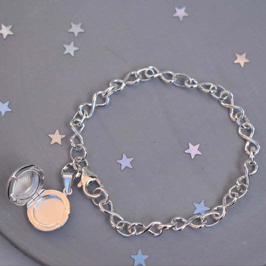 Sterling silver miniature locket on infinity link bracelet