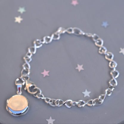 Sterling silver miniature locket on infinity link bracelet