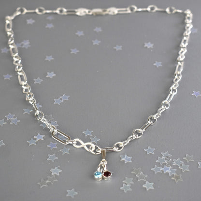 Sterling silver necklace of linked infinity symbols hung with birthstones of your choice