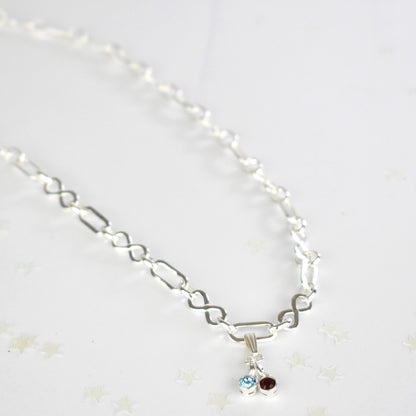 Sterling silver necklace of linked infinity symbols hung with birthstones of your choice