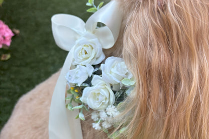 Ivory Silk Dog Ring Bearer Collar. Featuring delicate ivory silk roses and buds with a touch of woodland frosted greenery, this collar is finished with your choice of satin ribbon to match your colour scheme. Optional ring bearer clasp