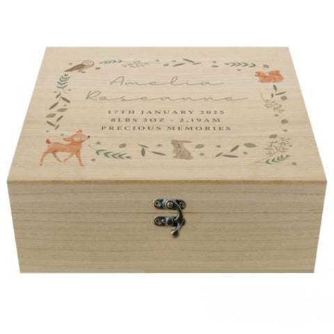  A personalised wooden keepsake box with woodland animal and leaves forming a square. Within the square is  five lines of personalised text, the first two in script font and the remaining three in block capitals. Fastened with a metal clasp.