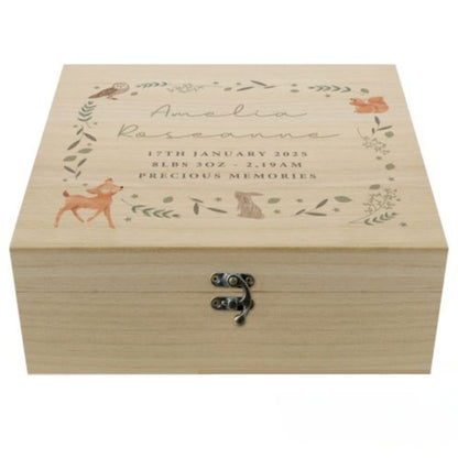 A personalised wooden keepsake box with woodland animal and leaves forming a square. Within the square is  five lines of personalised text, the first two in script font and the remaining three in block capitals. Fastened with a metal clasp.