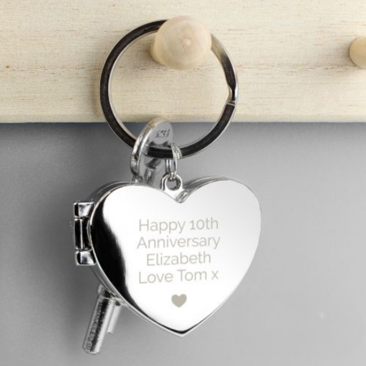 Heart-shaped keychain with your own personalised message above the heart motif.