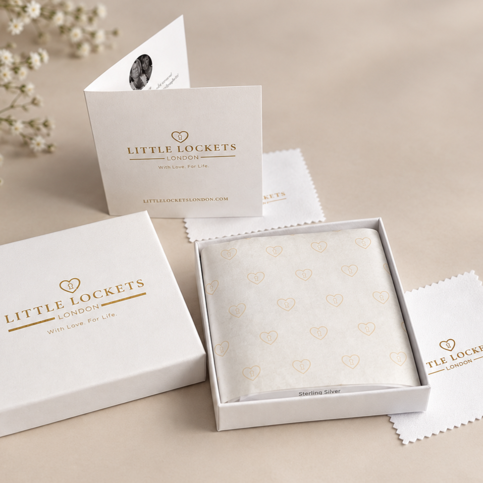 Little Lockets London gift box packaging with complimentary polishing cloth and care card. 