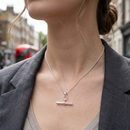 Model wears iconic chunky t bar necklace on superior belcher chain in sterling silver