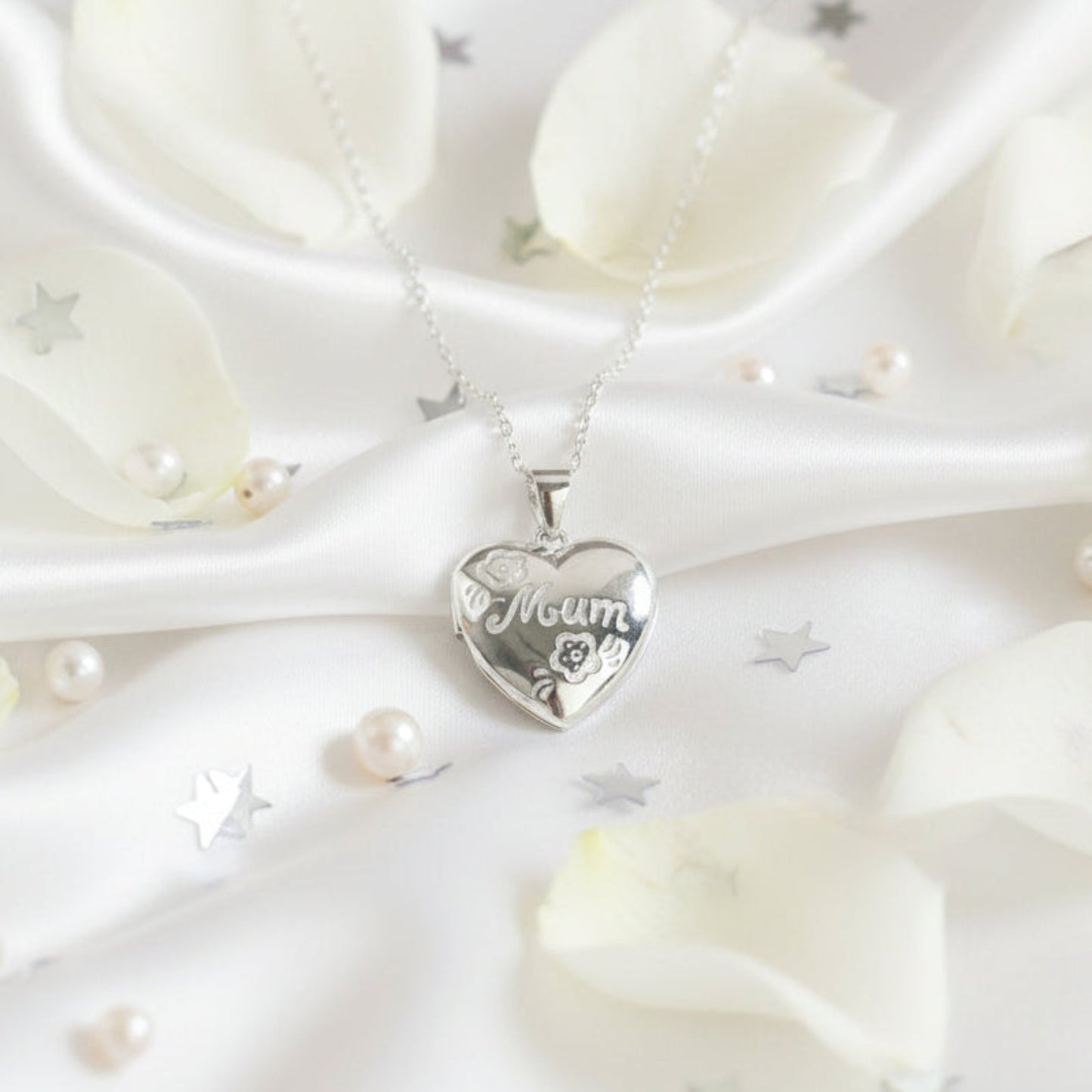 Sterling silver Mum locket with floral engraving on heart-shaped pendant