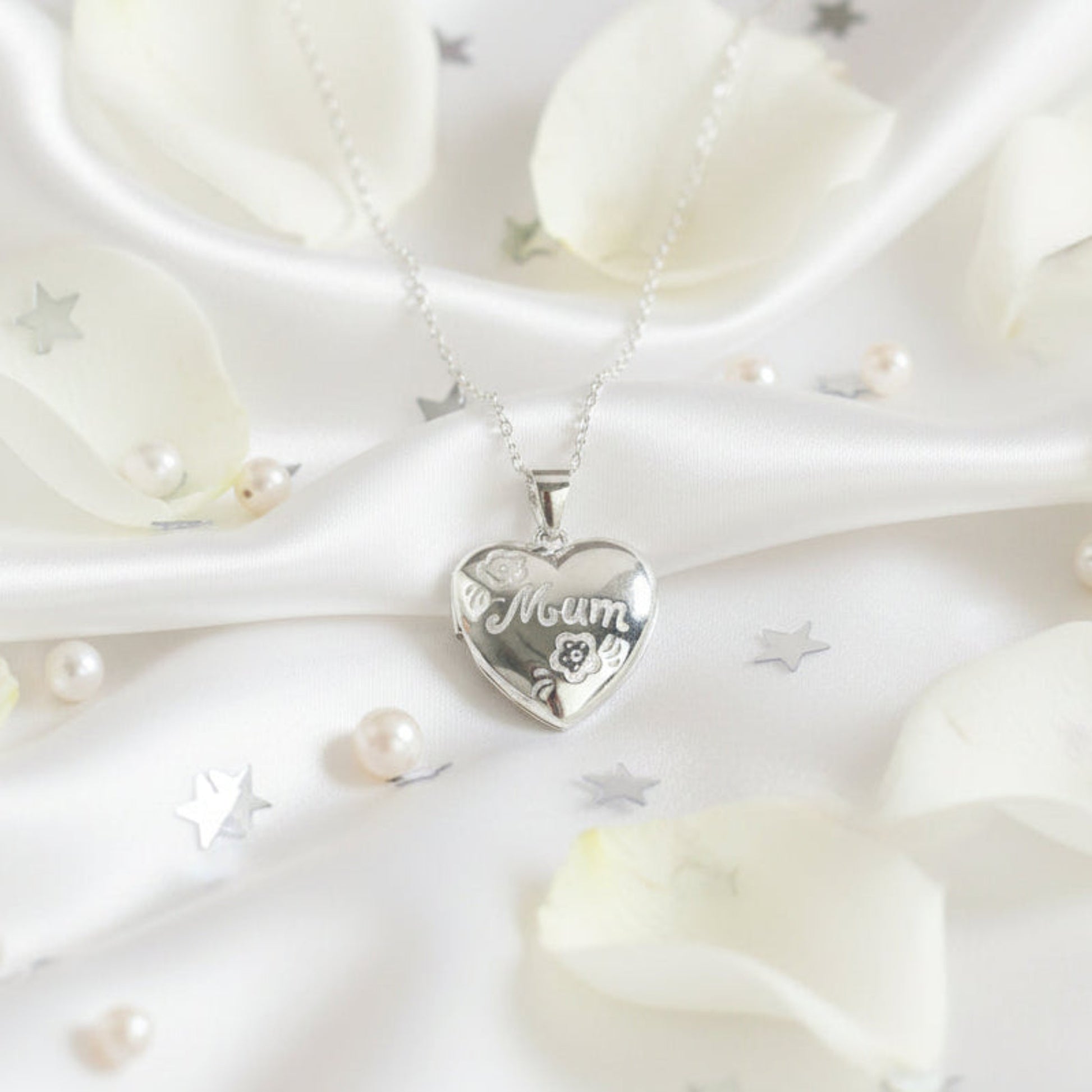 Sterling silver Mum locket with floral engraving on heart-shaped pendant