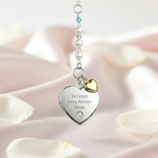Sterling silver engraved locket, with tiny gold plated sterling silver heart and your choice of wording engraved on the front. Suspended from a line of high quality Austrian crystals and pears with a tiny blue bead as a something blue