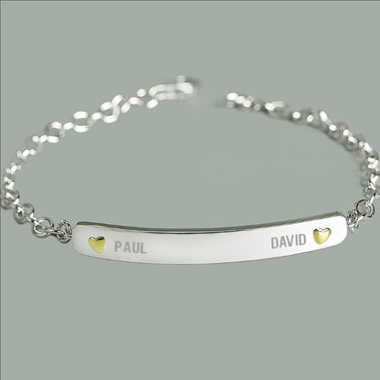 sterling silver bracelet engraved with two names and a tiny gold plated heart beside each