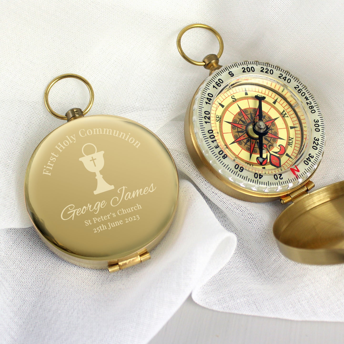 Full compass in brushed metal effect case, engraved with First Holy Communion and an etched chalice with cross. can bepersonalised with a name and message of your choice