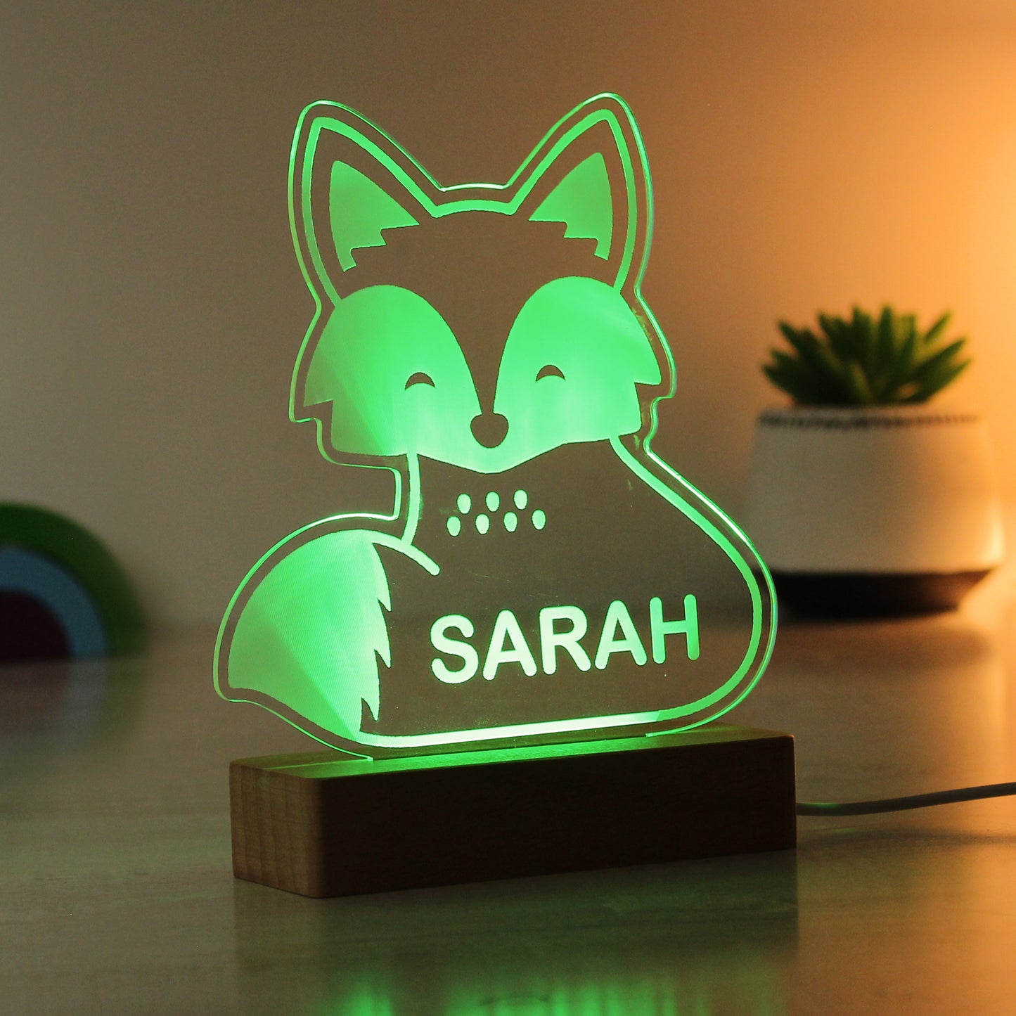 Childs LED light on wooden base. Fox  personalised with your child's name. Changing or fixed colour and brightness settings. Shown in green