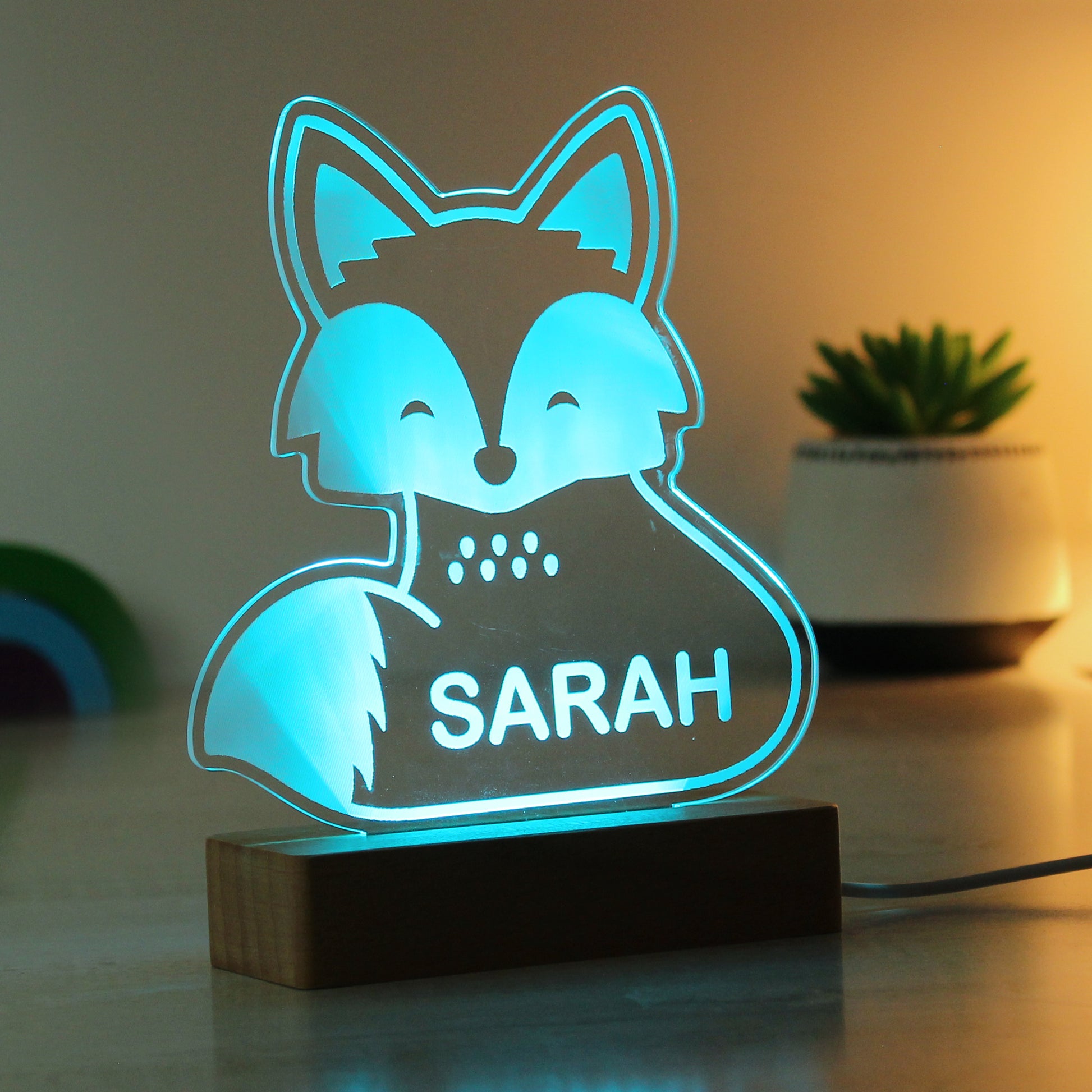 Childs LED light on wooden base. Fox  personalised with your child's name. Changing or fixed colour and brightness settings. Shown in blue